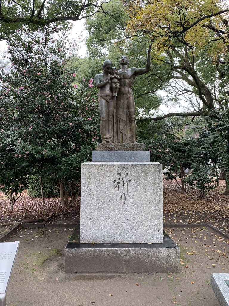 Statue of a man, woman, and child
