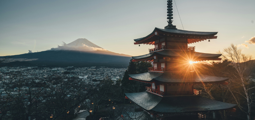 Sunrise behind Chureito Pagoda overlooking Fujiyoshida City with Mount Fuji in the background, Japan.